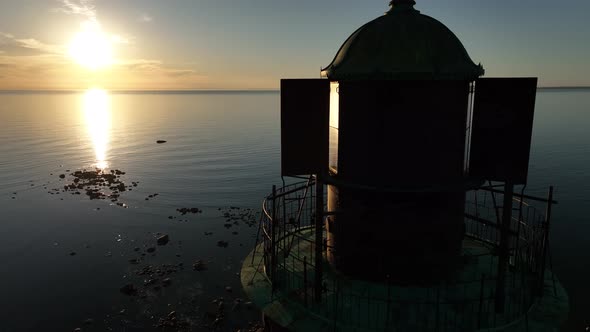 Aerial View of the Closeup Tower Lighthouse at Sunset