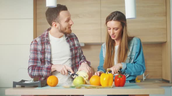 A Attractive Couple Is Cooking on Kitchen