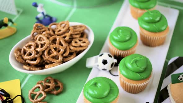 Kids football party set with snacks and drinks.