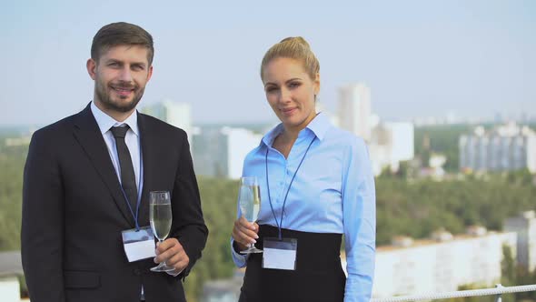 Happy Business People With Conference Cards Holding Champagne Glasses, Career