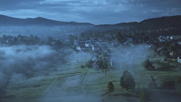 Night Mountain Village with Fog Aerial View