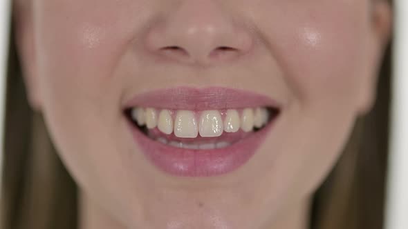 Lips and Teeth of Smiling Beautiful Young Woman