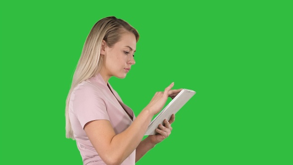 Girl holding digital tablet searching for something