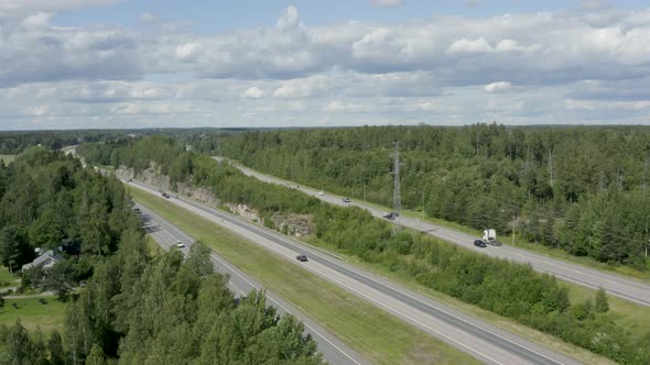 Expansive aerial view of a motorway in the countryside of Kerava, Finland.