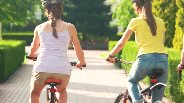 Four Young Cyclists on Bicycles