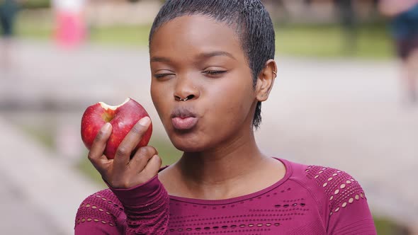 Beautiful Young Athletic Black Millennial Girl with Pleasure to Eat Delicious Apple Choose Wholesome