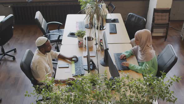 Woman and Man Working at Desks