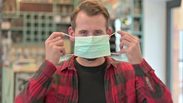 Portrait of Young Man Wearing Protective Face Mask