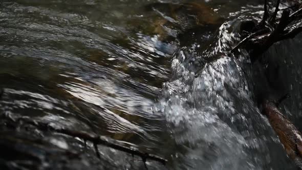 Wild clear mountain river , stream flowing through rocks