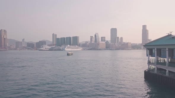 Hong Kong star ferry heading towards Kowloon. Aerial drone view