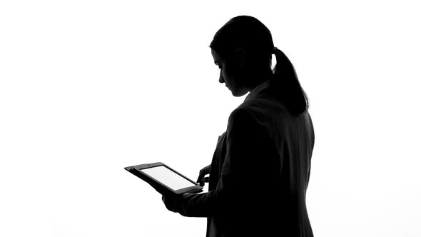 Woman Using Tablet Scrolling Information