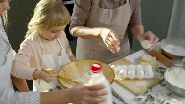 Little Girl Learning how to Make Dough
