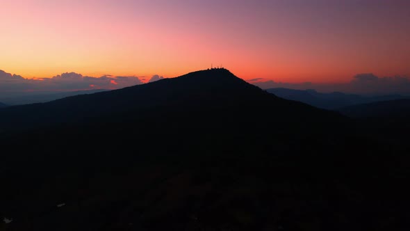 4K Aerial drone of Epic mountain with a colorful sunset drone aerial landscape shot