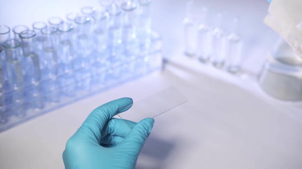Lab Technician Applies Samples of Saliva To Patients Infected with Coronavirus. Coronavirus 2019