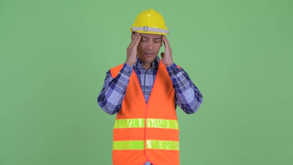 Stressed Multi Ethnic Man Construction Worker Having Headache