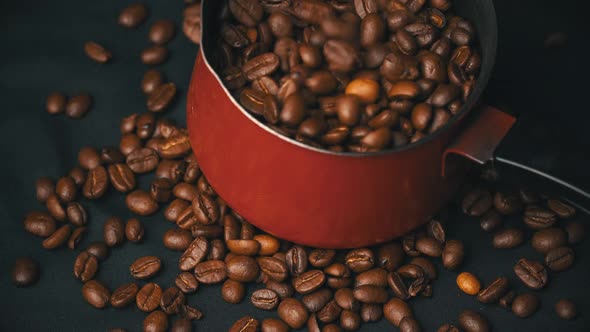 Roasted Grains of Coffee Roll in a Cezve