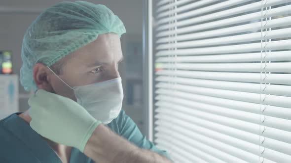 Male Medical Worker Smiling and Posing for Camera