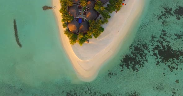 Aerial drone view of a scenic tropical island in the Maldives.