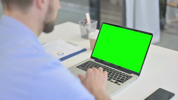 Creative Man Video Call on Laptop with Chroma Screen