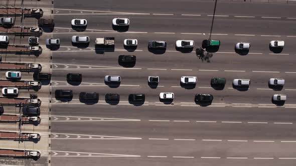 Cars on Lanes Stopping and Paying at Tolls