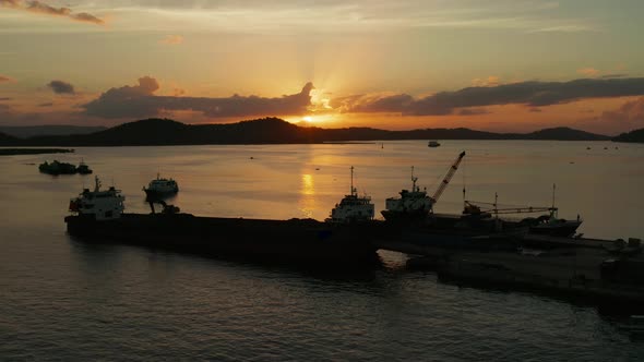 Sunset on a Tropical Island with a Seaport