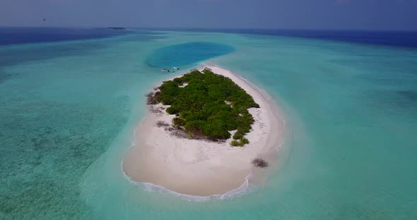 Tropical birds eye copy space shot of a white paradise beach and aqua turquoise water background 