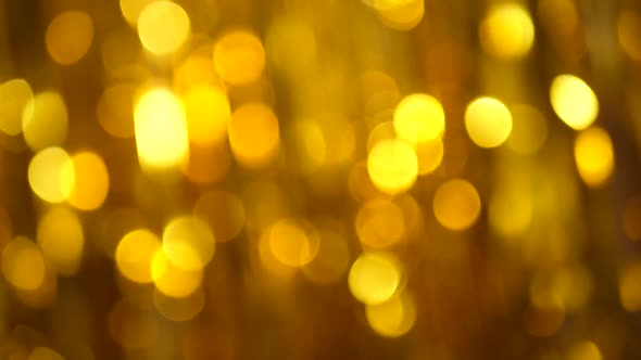 Festive Long Golden Tinsel Gleams in the Light