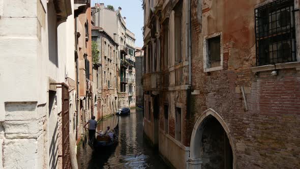 Gondolas in a canal in Venice