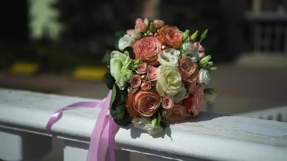 Beautiful Wedding Bouquet of the Bride on a White Table