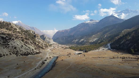 Aerial view of the Marsyangdi River flowing through valley near Manang