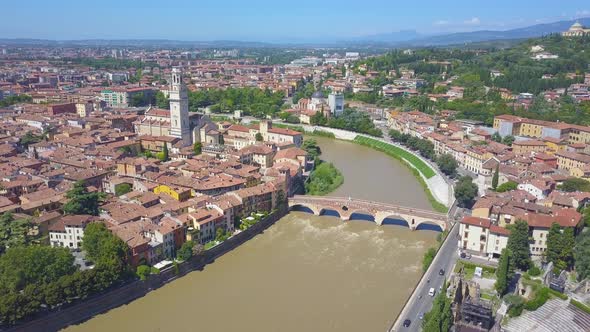 Panoramic aerial drone view of Verona, Italy. The drone flies over the river Adige