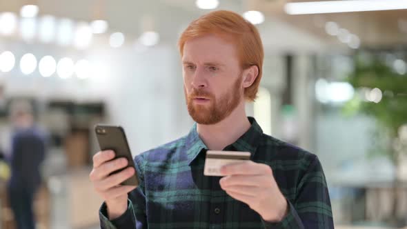 Portrait of Online Payment Failure on Smartphone By Beard Redhead Man