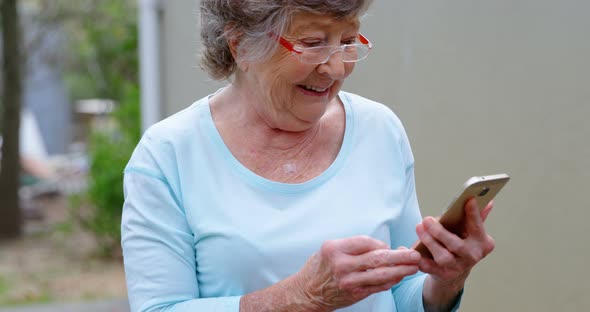 Senior Woman Using Mobile Phone 4k