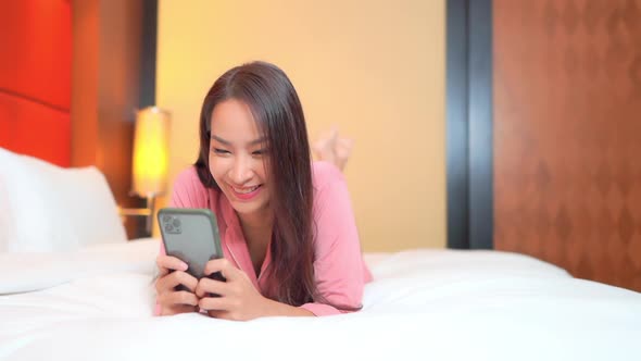 Young asian woman use smart phone