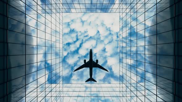 Passenger Plane Flying in the Sky with Clouds Over a Modern Glass Building