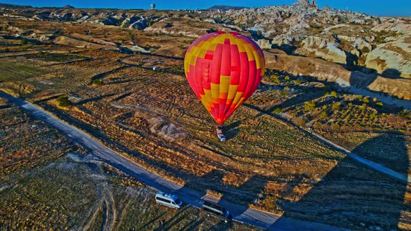 Sunrise and Hot Air Balloons Taking Off Over Valley