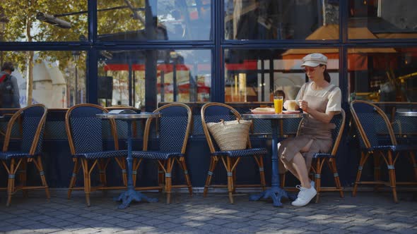 Young girl in a street cafe