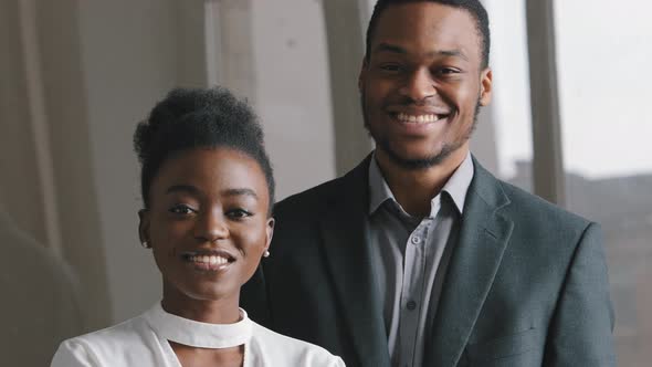 Confident Smiling Couple Millennial African American Woman and Man in Suit Looking at Camera Posing