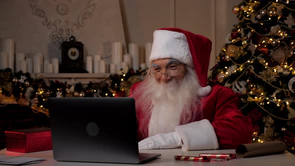 Smiling Santa Claus Greets Talks to Children Online Webcam Laptop Video Cal