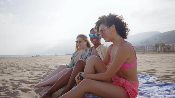 young women having fun on the beach