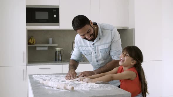 Focused Dad and His Girl Baking Together