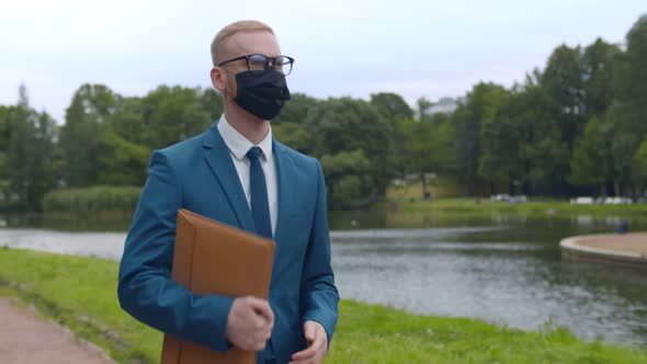 Young Businessman Wearing Mask for Protection From Corona Virus Outbreak Outdoors