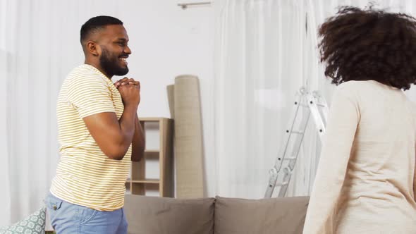 Couple Moving To New Home, Hugging and Kissing