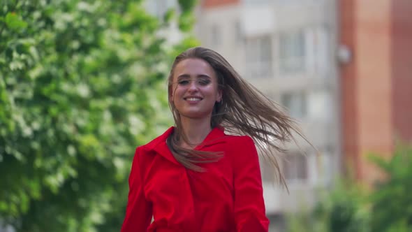 Woman walking in the street. Young beautiful woman smilling and walking in the town