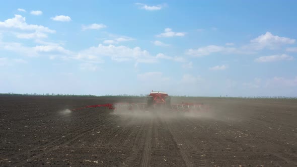 Working At The Field Tractor With The Seeder 15