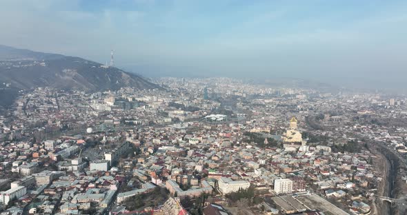 Aerial view of Holy Trinity Cathedral Sameba in Tbilisi Georgia. Sunrise drone footage.