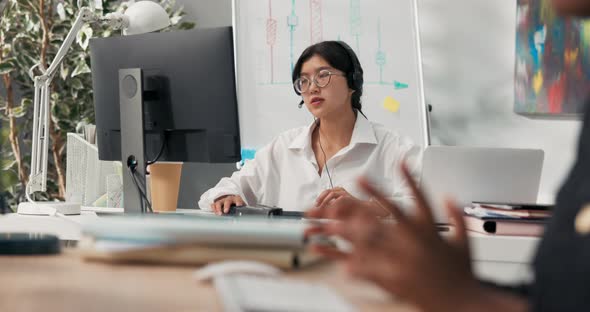 Beautiful Elegant Woman in Glasses with Asian Korean Beauty Sits in Office of Company with