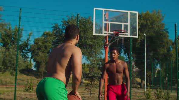 Fit Basketball Player Blocking Shot at Urban Court