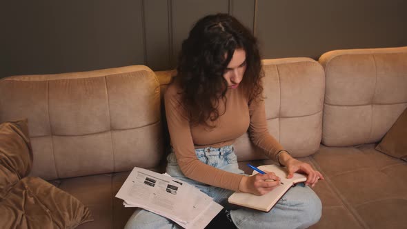 Young Woman Freelancer Does Distance Job at Home Studies Literature Learns Foreign Language Writes