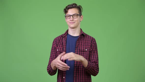 Young Handsome Teenage Nerd Boy Clapping Hands